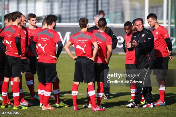 New head coach Huub Stevens of Stuttgart talks to players during a training session at the club's training ground on March 10, 2014 in Stuttgart,...