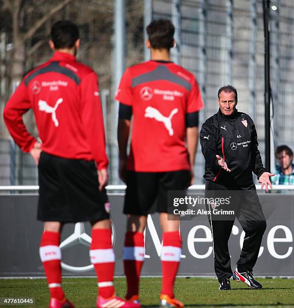 New head coach Huub Stevens of Stuttgart gives instructions to the players during a training session at the club's training ground on March 10, 2014...