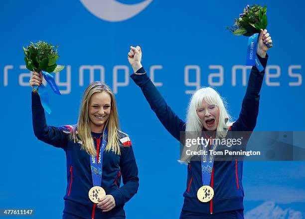 Gold medallists Kelly Gallagher of Great Britain and guide Charlotte Evans celebrate during the medal ceremony for the Women's Super-G - Visually...