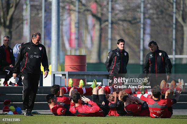 New head coach Huub Stevens of Stuttgart watches players exercise during a training session at the club's training ground on March 10, 2014 in...