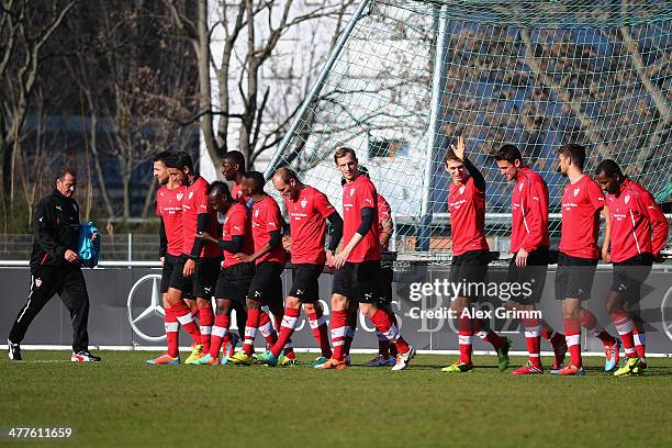 New head coach Huub Stevens of Stuttgart watches players carry a goal attends a training session at the club's training ground on March 10, 2014 in...