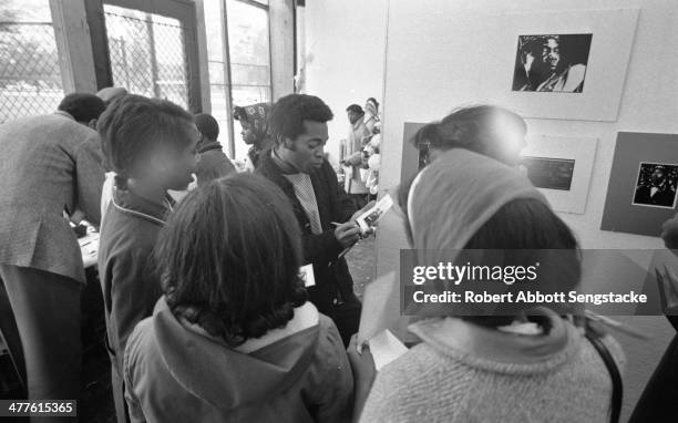 At Shepherd's Studio , photographer Billy 'Fundi' Abernathy speaks with students and children during his 'Live Flicks of the Hip World' exhibition,...