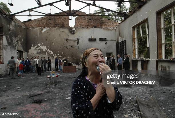 Woman cries in the ruins of the school gymnasium in Beslan, North Ossetia, 05 September 2004. The first funerals for the hundreds killed in the...