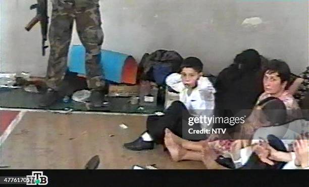 This TV grab image taken from Russian NTV channel 07 September 2004 shows Georgy Farniyev sitting among other hostages in the gymnasium of the Beslan...