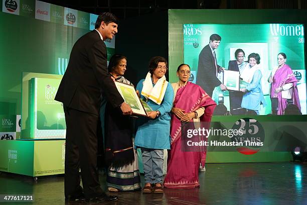 President of Coca Cola, India & South West Asia, Venkatesh Kini presents Limca Book of Records' People of the Year 2014 award to Sunitha Krishnan-...