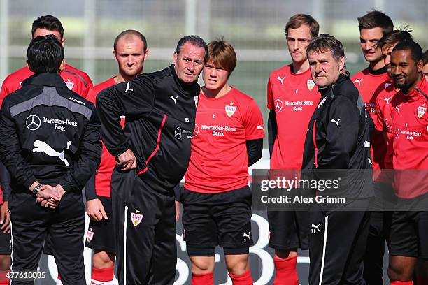 New head coach Huub Stevens and assistant coach Ton Lokhoff of Stuttgart talk to the players during a training session at the club's training ground...