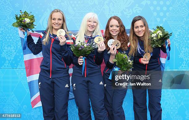 Kelly Gallagher of Great Britain and guide Charlotte Evans clebrates winning gold with bronze medallists Jade Etherington of Great Britain and guide...