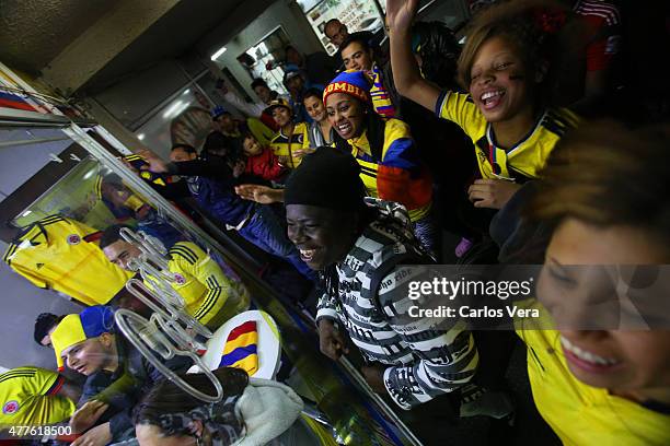 Fans of Colombia gather on a bar celebrate after the match between Brazil and Colombia as part of 2015 Copa America Chile Group C at Monumental David...