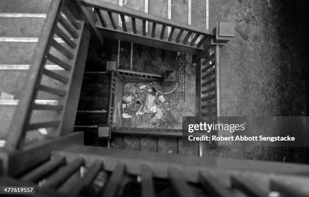 View of a garbage strewn stairwell in an apartment building in the Englewood neighborhood, Chicago, Illinois, 1968.