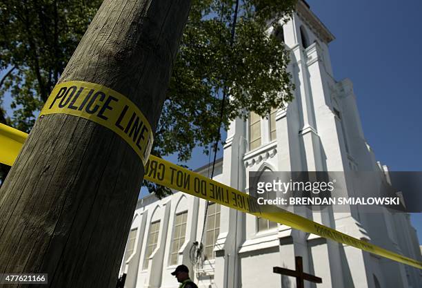 Police tape is seen outside the Emanuel AME Church, after a mass shooting at the Emanuel AME Church the night before in Charleston, South Carolina on...