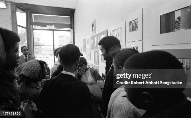 At Shepherd's Studio , photographer Billy 'Fundi' Abernathy speaks with students and children during his 'Live Flicks of the Hip World' exhibition,...