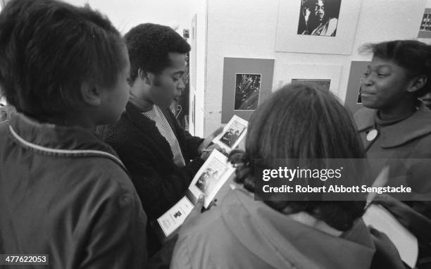 At Shepherd's Studio , photographer Billy 'Fundi' Abernathy speaks with students and children during his 'Live Flicks of the Hip World' exhibition,...
