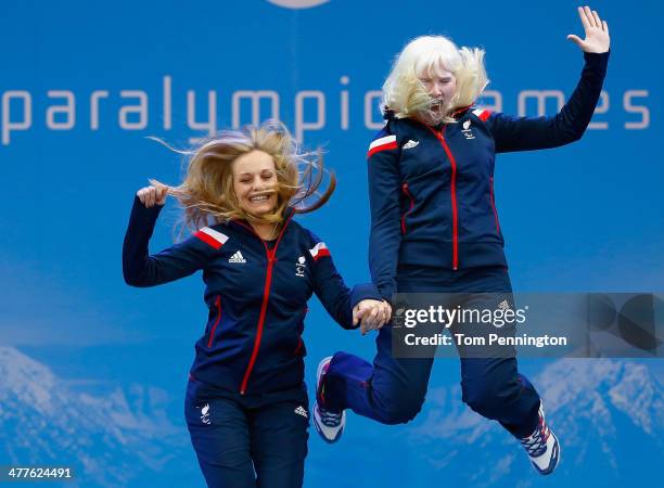 Gold medallists Kelly Gallagher of Great Britain and guide Charlotte Evans celebrate during the medal ceremony for the Women's Super-G - Visually...