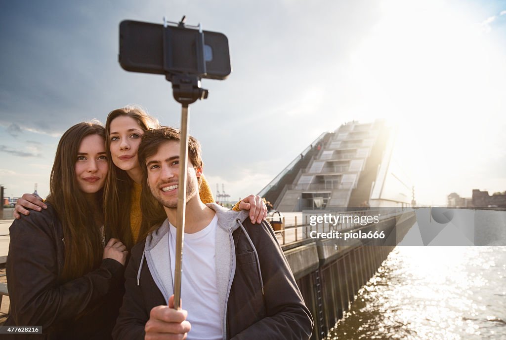 Friends taking a selfie stick in Hamburg