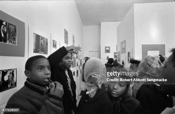 At Shepherd's Studio , photographer Billy 'Fundi' Abernathy speaks with students and children during his 'Live Flicks of the Hip World' exhibition,...