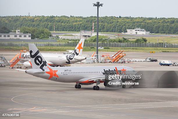 jetstar japan - jetstar plane stock pictures, royalty-free photos & images