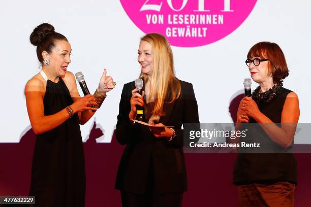 Martina Arfwidson, Andrea Ketterer and Gun Nowak pose with their awards during the Glammy Award by Glamour Magazine on March 6, 2014 in Munich,...