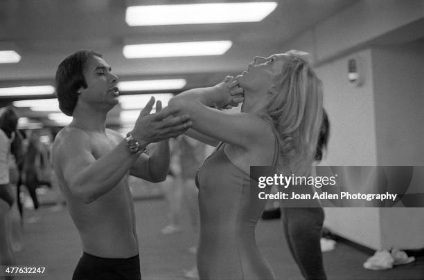 Founder and teacher of Bikram Yoga, Bikram Choudhury assists actress Carol Lynley with the 'Standing Deep Breathing' posture at his yoga studio in...