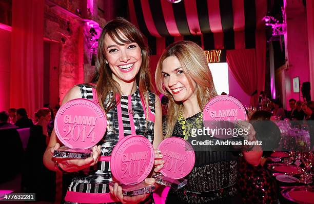 Jana Sazepin and Isabelle Schleemilch pose with their awards during the Glammy Award by Glamour Magazine on March 6, 2014 in Munich, Germany.