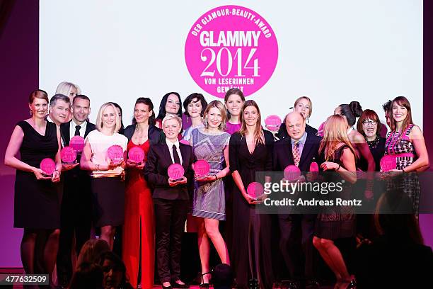 Glammy winners pose with their awards during the Glammy Award by Glamour Magazine on March 6, 2014 in Munich, Germany.