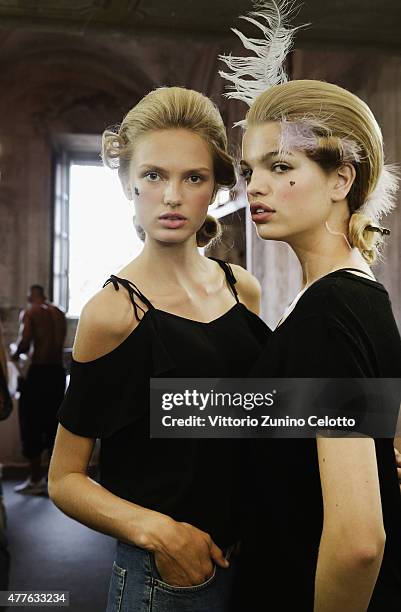 Model Romee Strijd and Daphne Groeneveld pose backstage prior to the Moschino Men's Fashion Show Spring/Summer 2016 during the 88 Pitti Uomo on June...