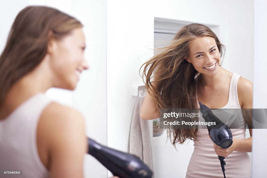 Blowdrying her hair