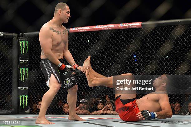 Cain Velasquez of the United States stands over Fabricio Werdum of Brazil in their UFC heavyweight championship bout during the UFC 188 event inside...