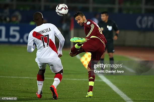 Luis Advincula of Peru fights for the ball with Ronald Vargas of Venezuela during the 2015 Copa America Chile Group C match between Peru and...