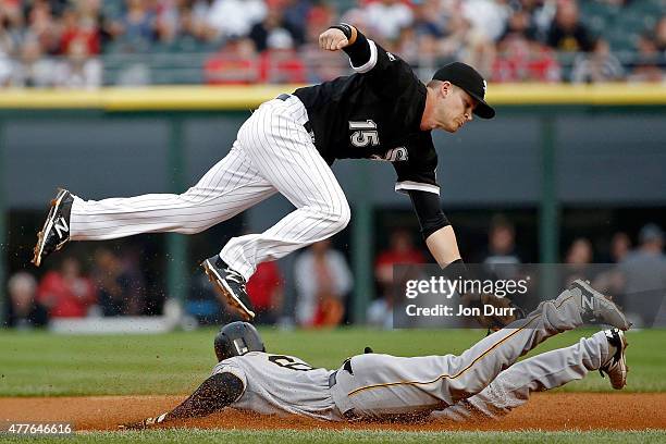 Gordon Beckham of the Chicago White Sox tags out Starling Marte of the Pittsburgh Pirates on an attemp to steal second base during the first inning...