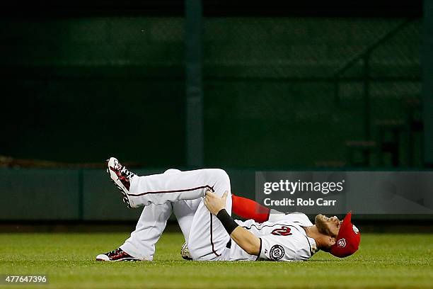 Bryce Harper of the Washington Nationals reacts on the field after being injured in the sixth inning against the Tampa Bay Rays at Nationals Park on...