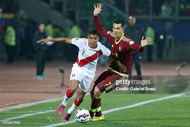 Paolo Hurtado of Peru fights for the ball with Nicolas Fedor of Venezuela during the 2015 Copa America Chile Group C match between Peru and Venezuela...