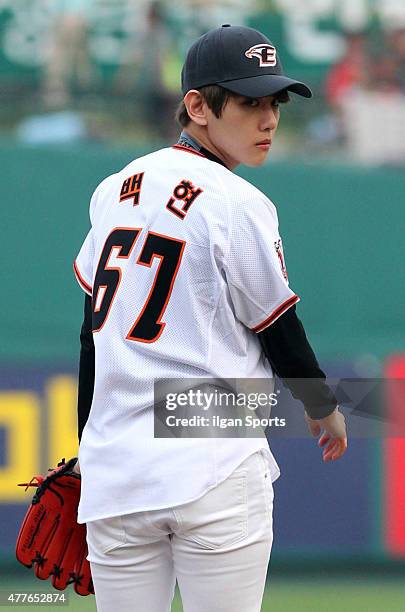 Baekhyun of EXO throws out the ceremonial first pitch before the game between Hanwha Eagles VS SK Wyverns at Eagles Park on June 16, 2015 in Daejeon,...