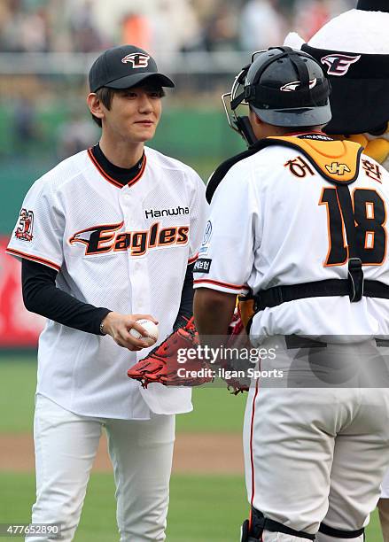 Baekhyun of EXO throws out the ceremonial first pitch before the game between Hanwha Eagles VS SK Wyverns at Eagles Park on June 16, 2015 in Daejeon,...