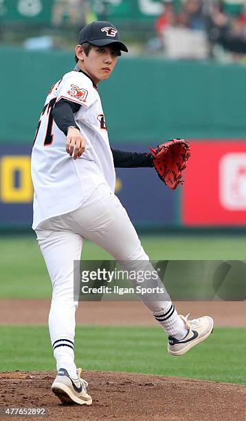 Baekhyun of EXO throws out the ceremonial first pitch before the game between Hanwha Eagles VS SK Wyverns at Eagles Park on June 16, 2015 in Daejeon,...