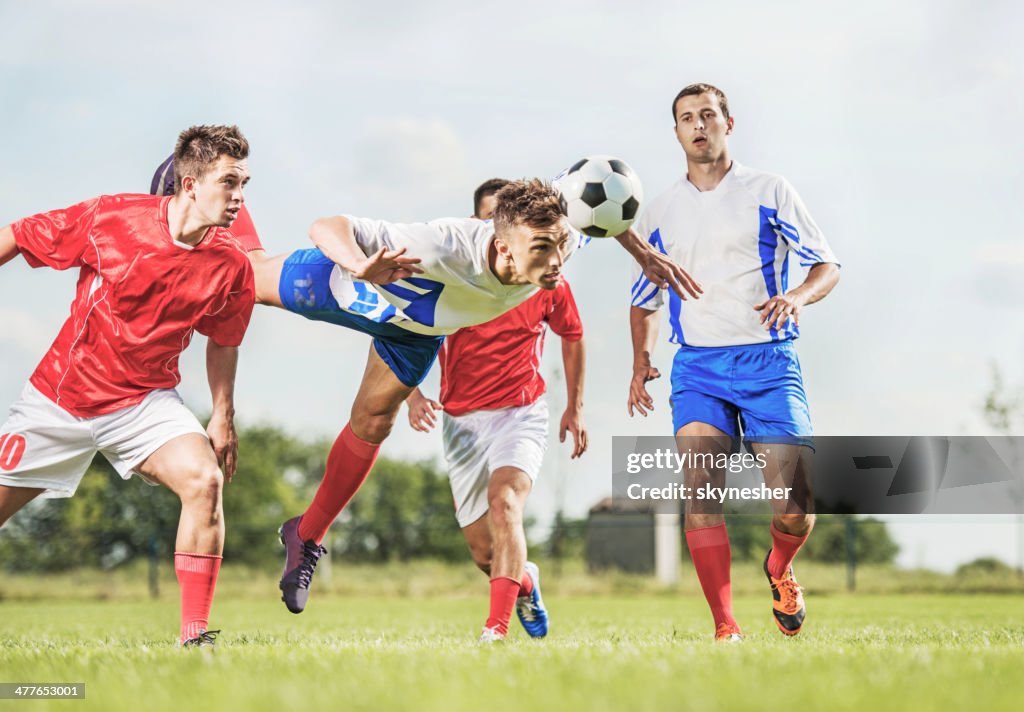 Soccer player heading the ball.