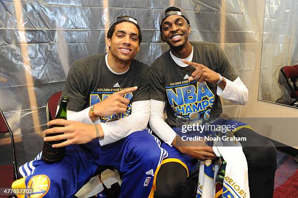 James Micahael McAdoo and Justin Holiday of the Golden State Warriors celebrates winning the Larry O'Brein Trophy after Game Six of the 2015 NBA...