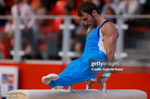 Tomas Gonzalez of Chile competes in the Men's Pommel Horse Event during day four of the X South American Games Santiago 2014 at Centro de Alto...