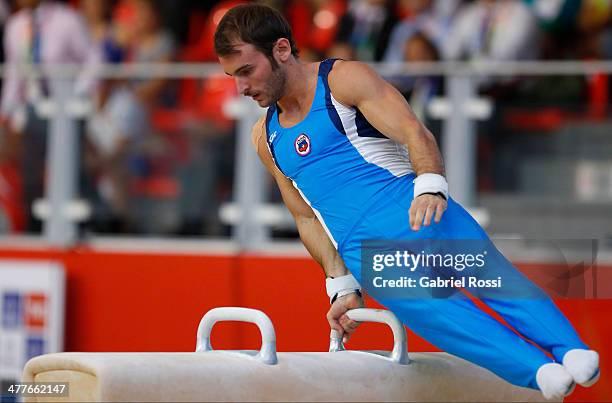 Tomas Gonzalez of Chile competes in the Men's Pommel Horse Event during day four of the X South American Games Santiago 2014 at Centro de Alto...