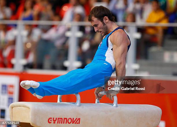Tomas Gonzalez of Chile competes in the Men's Pommel Horse Event during day four of the X South American Games Santiago 2014 at Centro de Alto...
