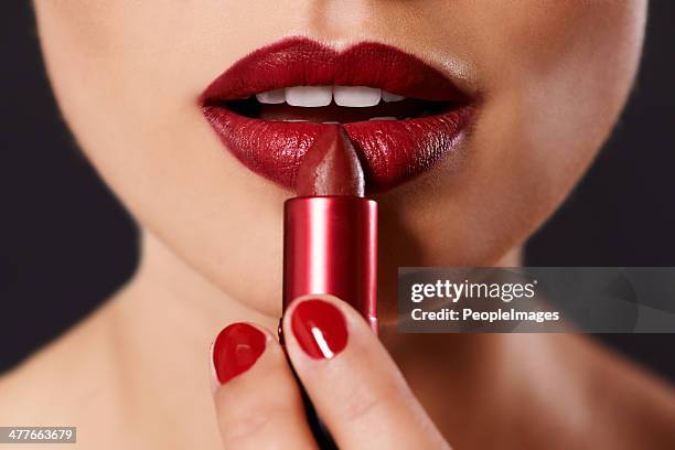 every woman has a favourite shade... - applying make up stockfoto's en -beelden