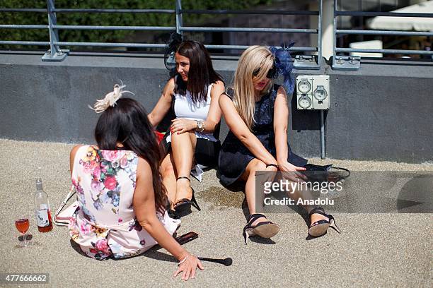 Racegoers watching the races on Ladies Day of Royal Ascot at Ascot racecourse in Berkshire, England on June 18, 2015. The 5 day showcase event, which...