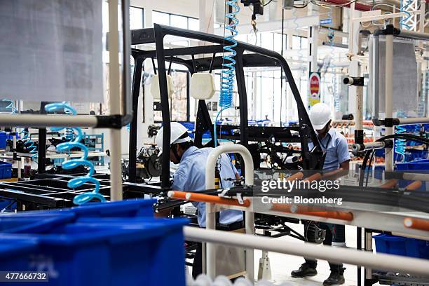 Employees wire the frame of an Eicher Polaris Pvt. Multix personal utility vehicle at the company's factory in Jaipur, Rajasthan, India, on Thursday,...