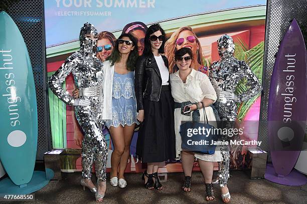 Guests attend the Sunglass Hut celebration "Electrify Your Summer" with Georgia May Jagger, Chanel Iman & Nick Fouquet on June 18, 2015 in New York...