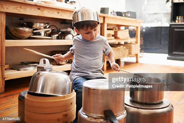check out my awesome drumming technique! - boy sitting on floor stockfoto's en -beelden