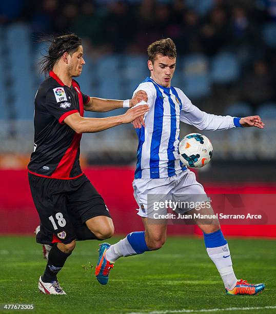 Antoine Griezmann of Real Sociedad duels for the ball with Ze Castro of Rayo Vallecano during the La Liga match between Real Sociedad and Rayo...