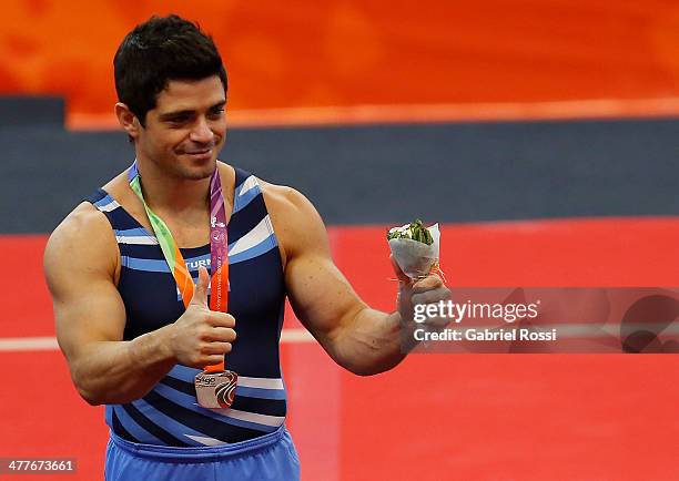 Federico Molinari of Argentina gives a thumb up after winning silver in the podium of Men's Rings during day four of the X South American Games...