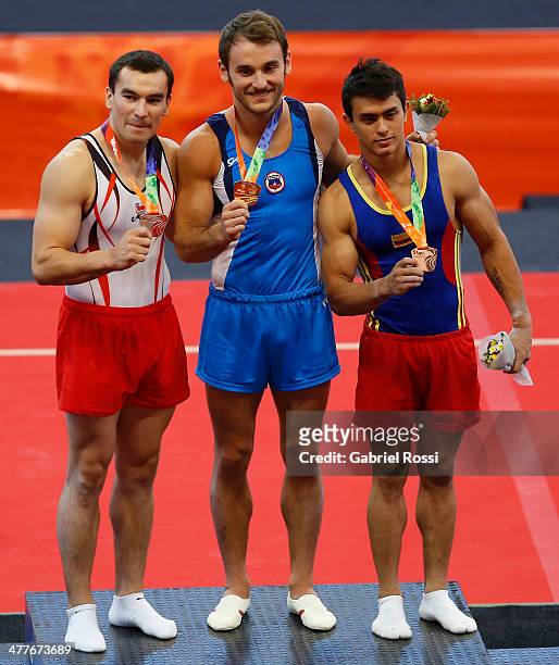 Juan Pablo Gonzalez of Chile, Tomas Gonzalez of Chile and Jossimar Calvo of Colombia in the podium Men's Floor during day four of the X South...