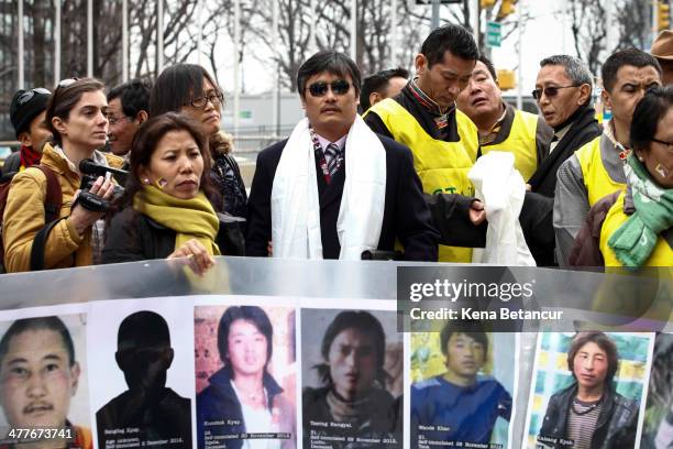 Chinese dissident Chen Guangcheng attends the 55th anniversary of the Tibetan national uprising day rally outside the United Nations building on...