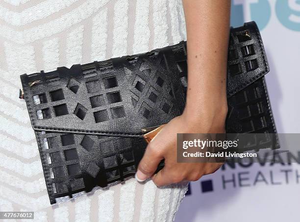 Actress Liannet Borrego, purse detail, attends the Black AIDS Institute 2015 Heroes in the Struggle Gala Reception and Awards Ceremony at the...
