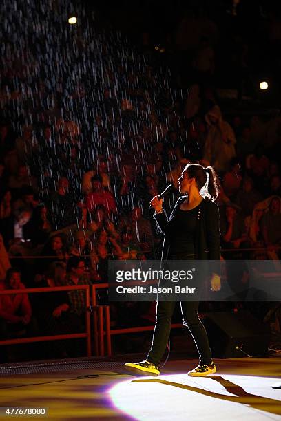 Whitney Cummings performs through the rain during the opening night of SeriesFest at Red Rocks Amphitheatre on June 18, 2015 in Morrison, Colorado.